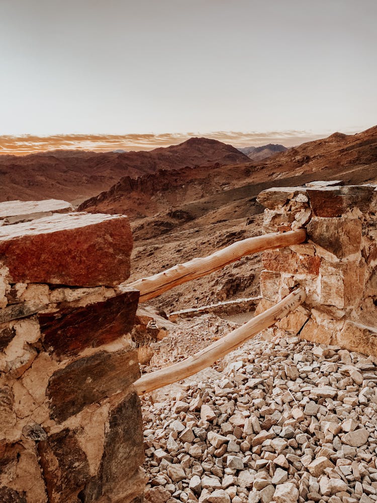 Stone Wall With Barren Hills In The Background