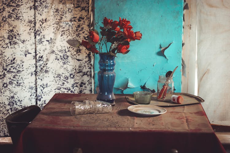 Flower Vase Over A Dusty Table