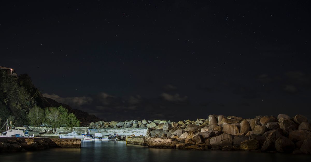 Rocks on the Shore at Night · Free Stock Photo
