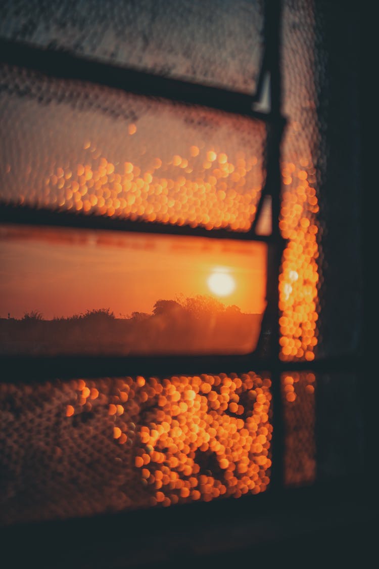 A View Of Sunset From A Window