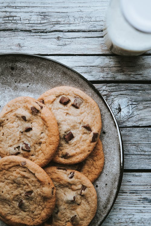 Free Chocolate Chip Cookies on Wooden Table  Stock Photo