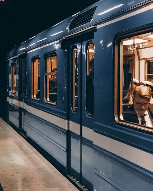 Free White and Blue Train With People Stock Photo