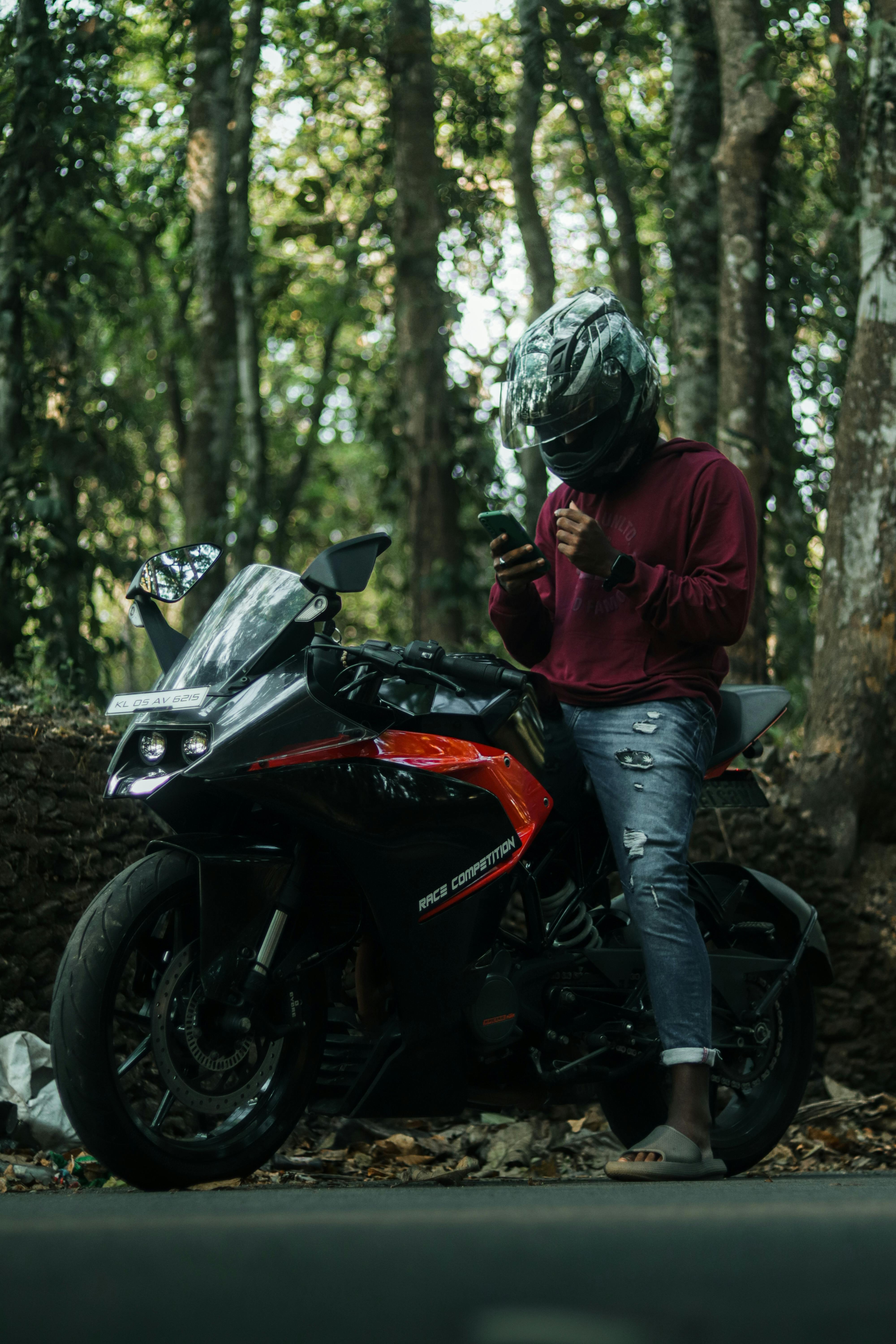 Boy posing on KTM bike in the forest - PixaHive