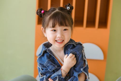 Free Close-Up Shot of a Cute Girl in Blue Denim Jacket Stock Photo