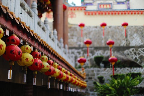 Traditional Style Building Decorated with Yellow and Red Lanterns