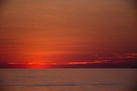 Body of Water Under Red Sky