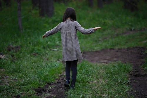 Girl Walking on Grass