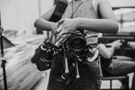 Grayscale Photo of Woman Holding Dslr Camera