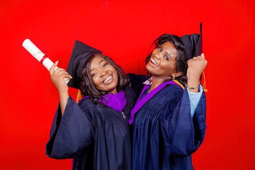 Happy Women in Graduation Gown 