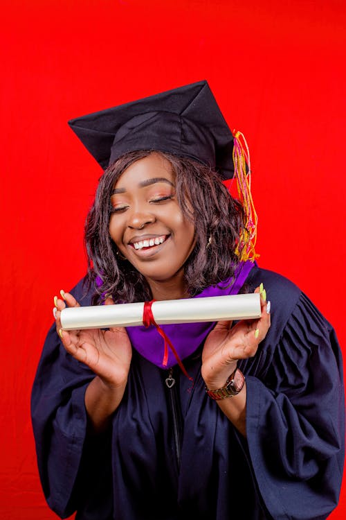 A Happy Woman Holding Her Diploma