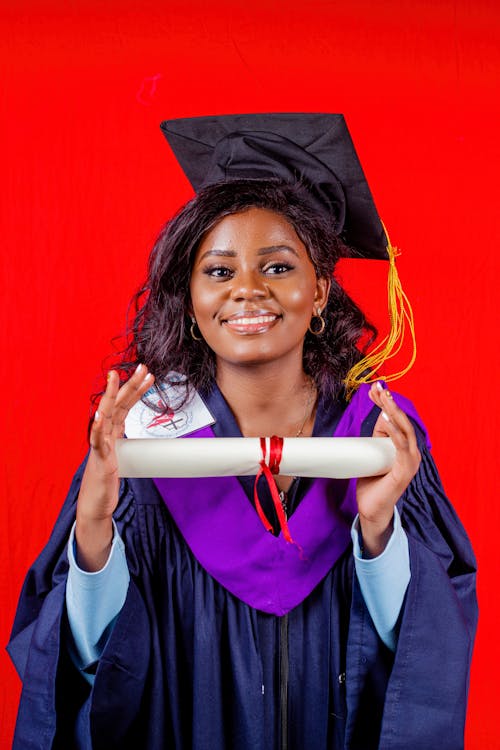 A Woman Posing with Her Diploma