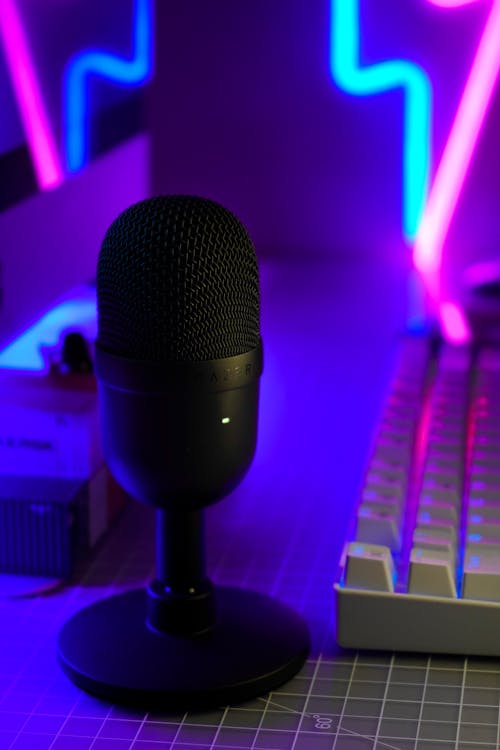 Close-Up Shot of a Condenser Microphone Near a Keyboard