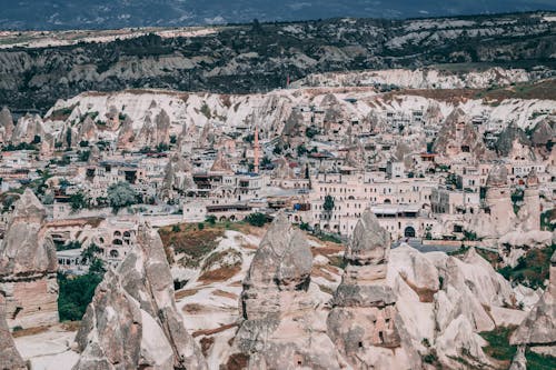 Gray Concrete Building Near Rock Forms