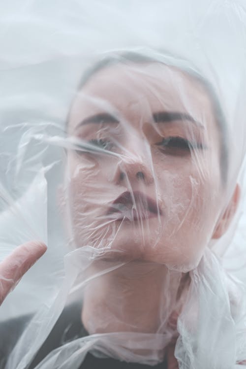 Womans Face Behind a See-Through Veil 