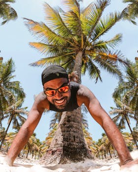 Man enjoying a sunny day at a palm tree plantation in Brazil, PE. Relaxation and holiday vibes.