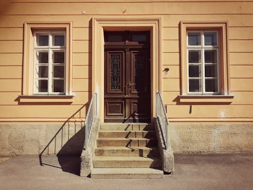 Yellow Wooden Building with Wooden Doors