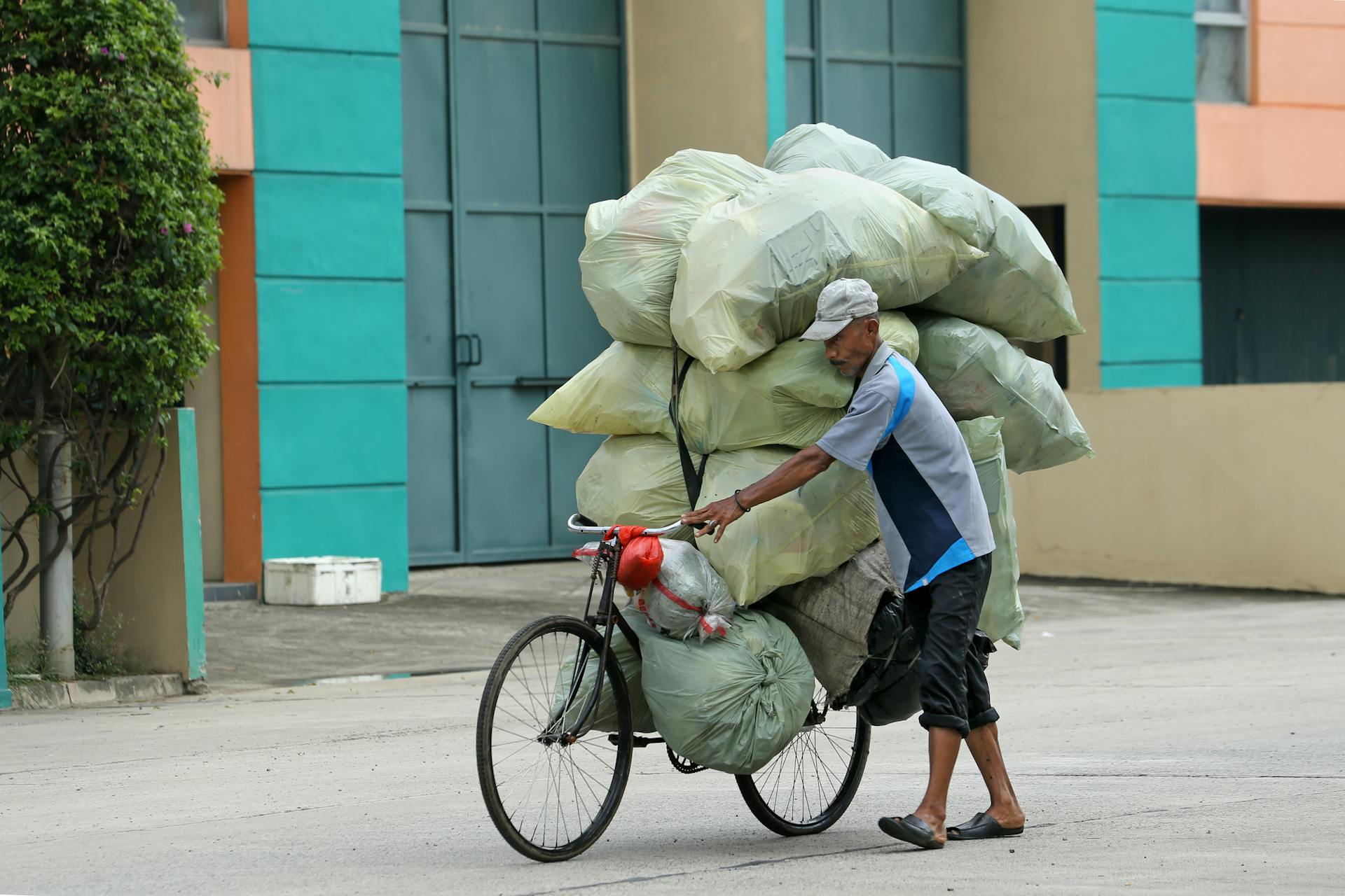 A Man with Bags on a Bicycle