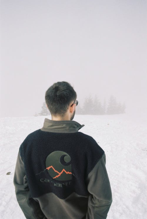 Back View of a Man Looking at the Snow