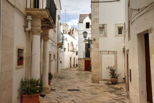 Free Explore the picturesque alleys and historic architecture of Locorotondo in Puglia, Italy. Stock Photo