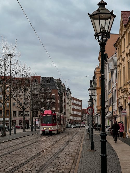 Free Red Tram Near Buildings Stock Photo