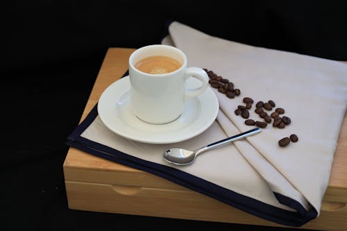 A Teaspoon Beside a Cup of Coffee