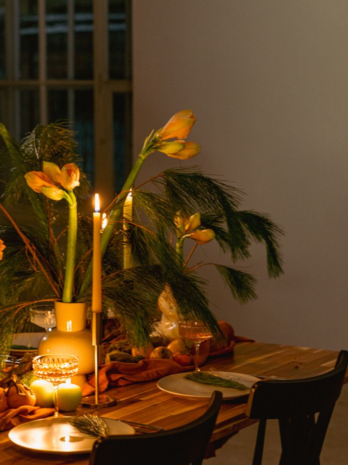 Table set for a candlelight dinner with flowers