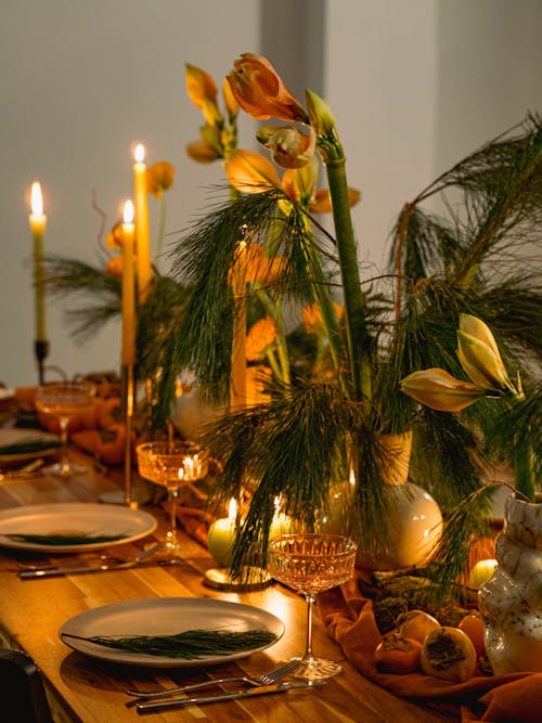 Flowers and Wax Candles on Table