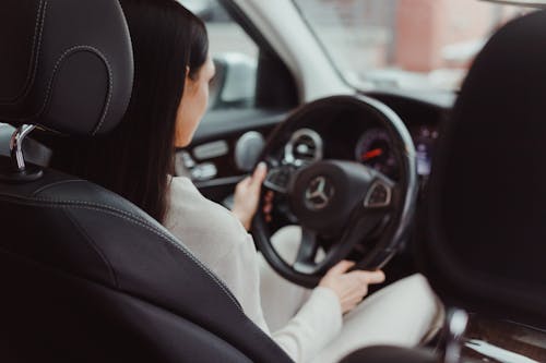 Photo of a Woman Driving a Car