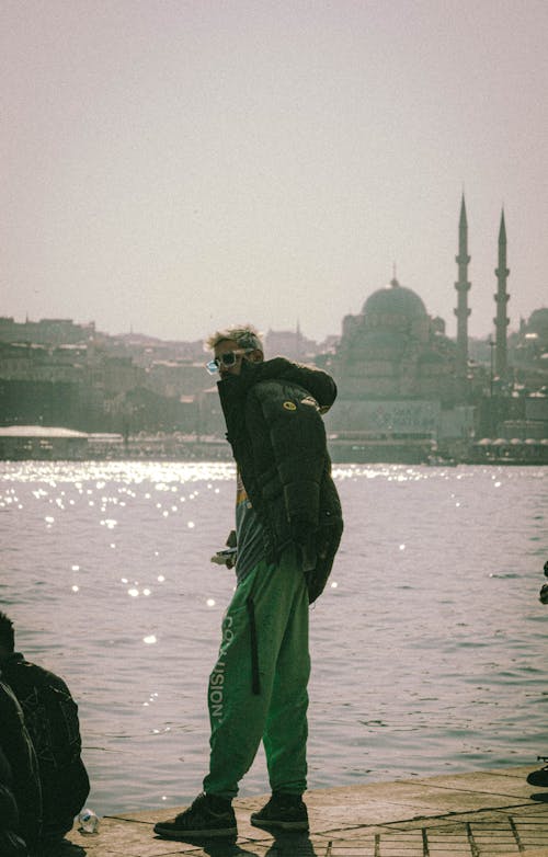 Man in Jacket Standing on Sea Shore in Istanbul