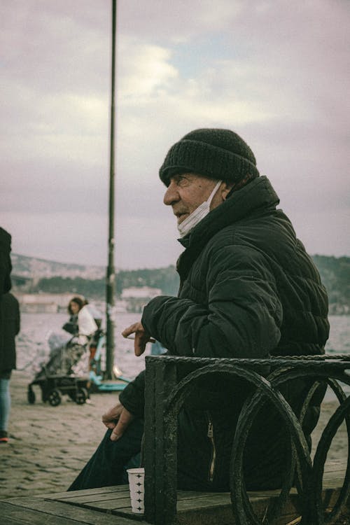 Photo of an Elderly Man with a Beanie Wearing a Jacket