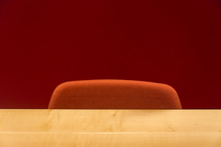 Chair Behind A Wooden Desk 