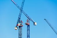 Red and White Crane Under Blue Sky
