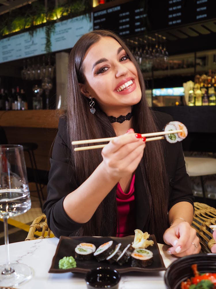 A Woman Eating Japanese Food