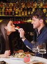 Man and Woman Eating Food