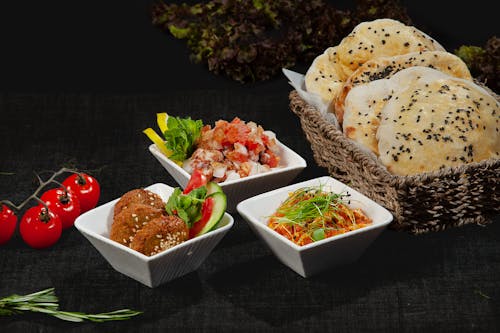 Close-Up Shot of Delicious Food on White Ceramic Bowls