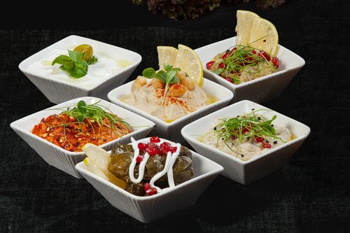 Free A selection of delicious Mediterranean appetizers served in stylish ceramic bowls. Stock Photo