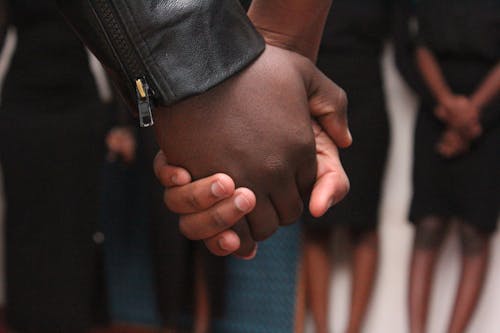 Free Selective Focus Photography of Man and Woman Holding Hand Each Other Stock Photo