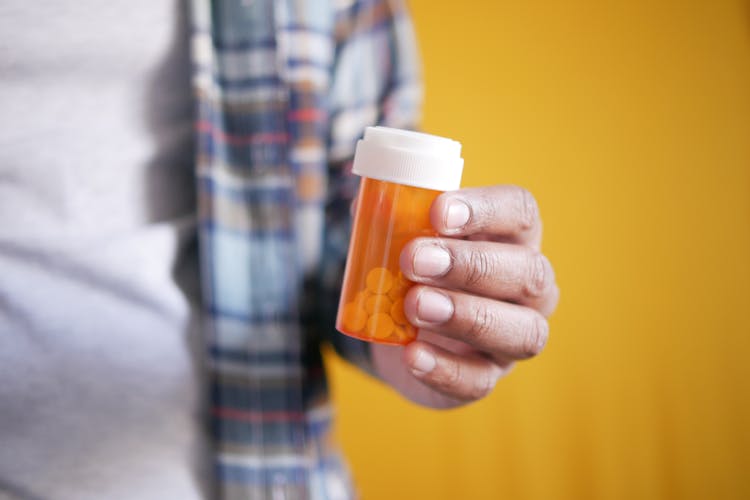 Hand Holding Box With Pills 