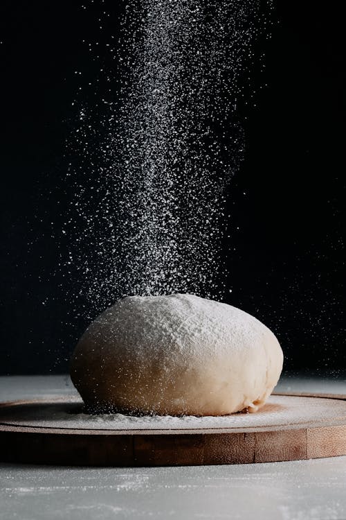 Free Flour Pouring on Dough Bun Stock Photo