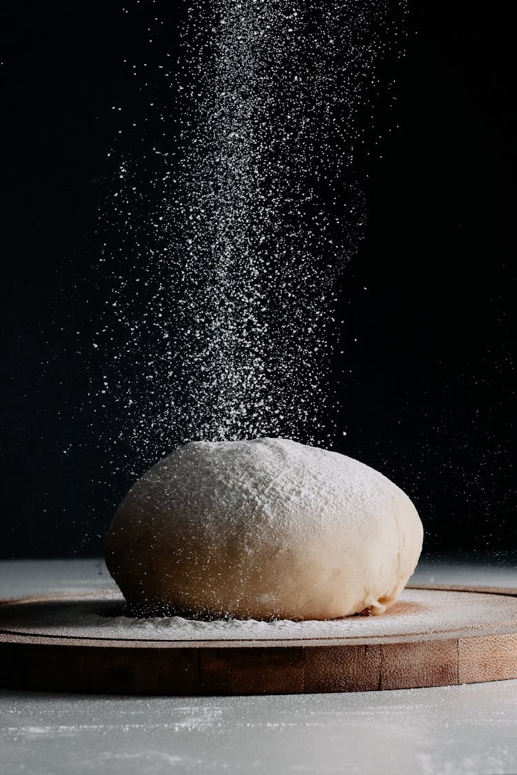 Flour Pouring On Dough Bun