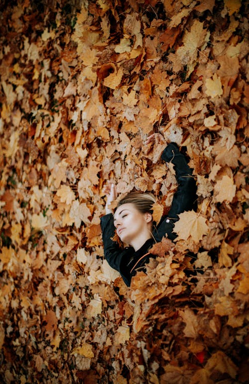 A Woman Lying on a Fallen Leaves