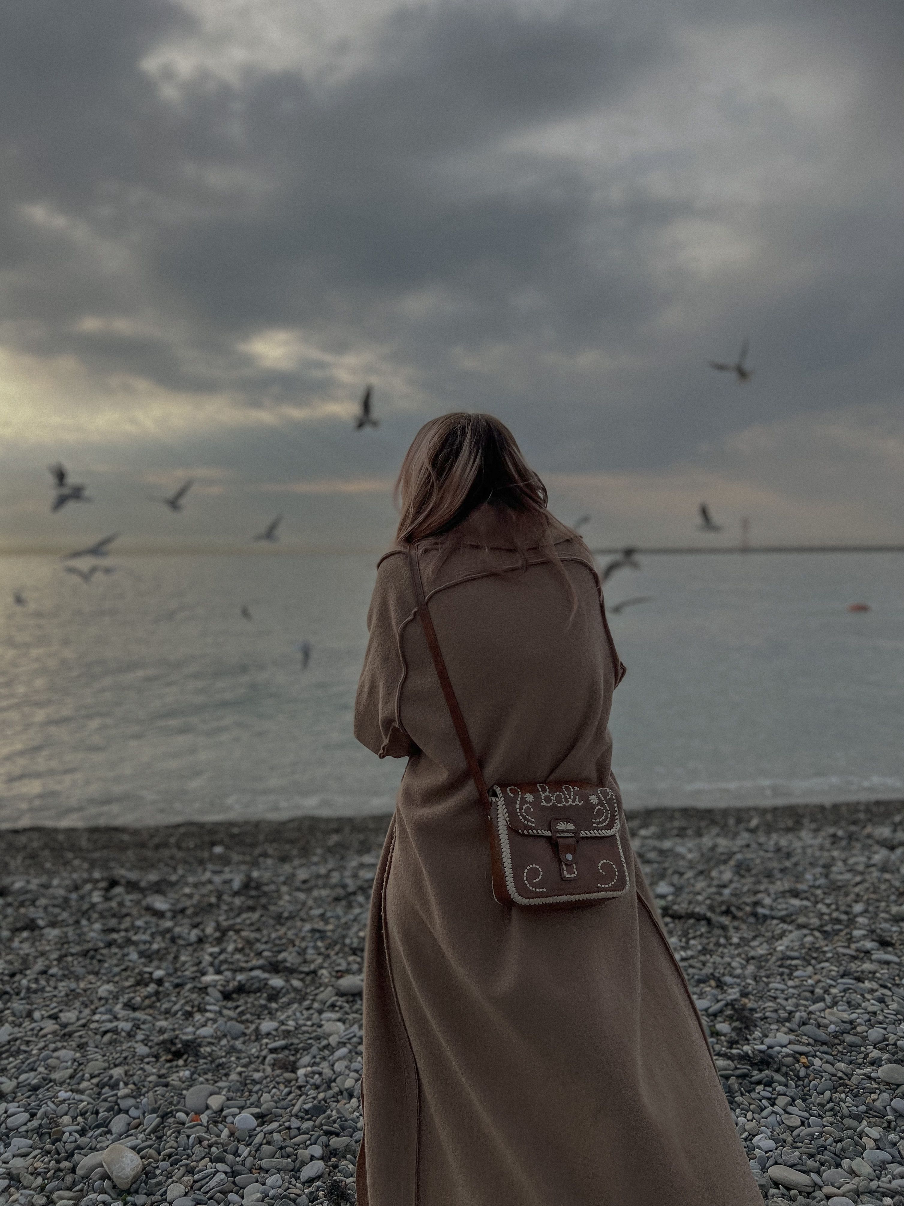 Back View of Woman in Brown Trench Coat Standing in the Beach · Free ...
