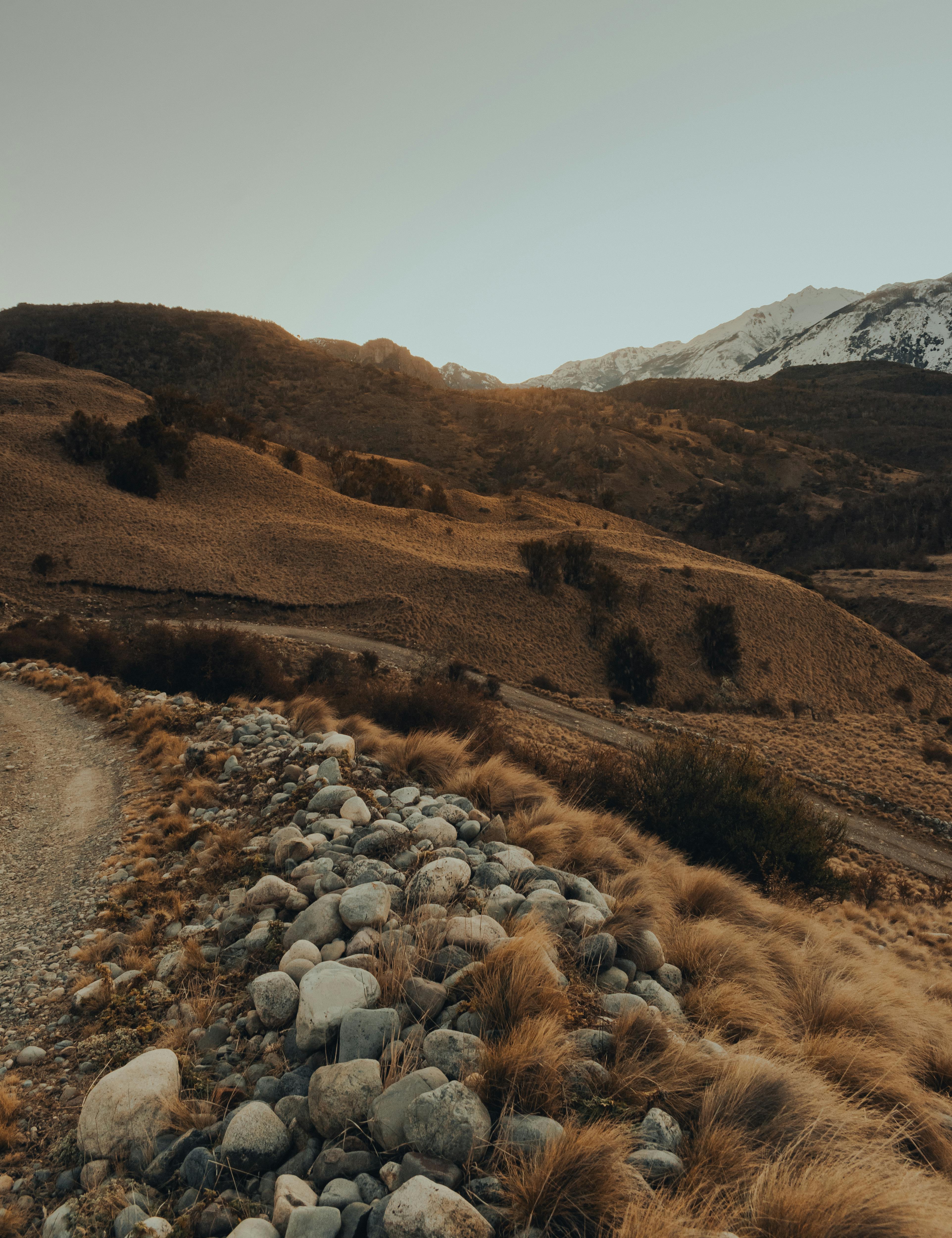 Beautiful mountainous landscape during autumn at dawn with stones and rugged terrain.