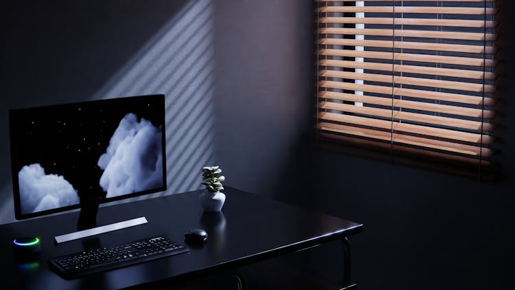 Black Desk With Computer Near Window With Blinds