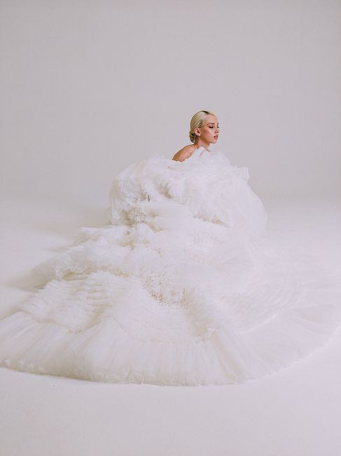 Stunning bridal portrait featuring a woman in a voluminous white gown, perfect for a wedding shoot.