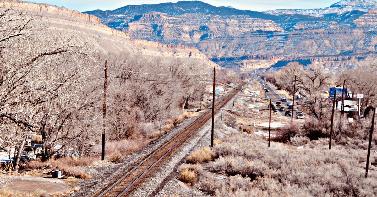 Aerial view of railway tracks and road in the stunning landscape of Grand Junction, Colorado.