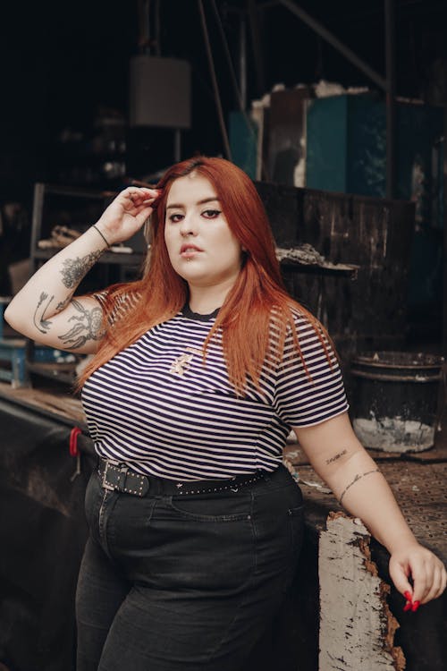 Woman in Black and White Striped Shirt and Black Denim Jeans