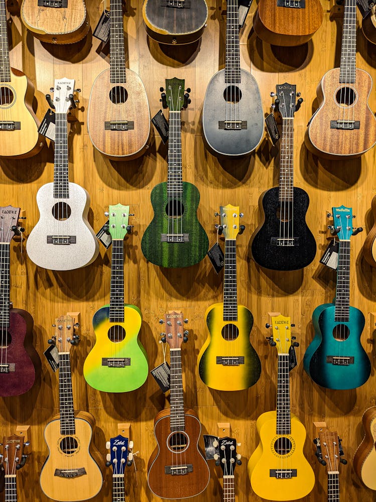 Acoustic Guitars Hanging On The Wall