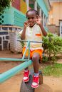 A Child Riding a Seesaw