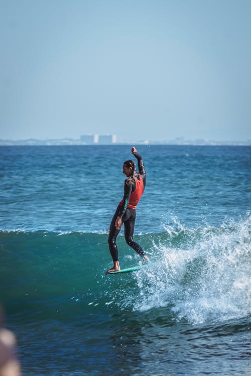 A Woman Surfing on the Sea